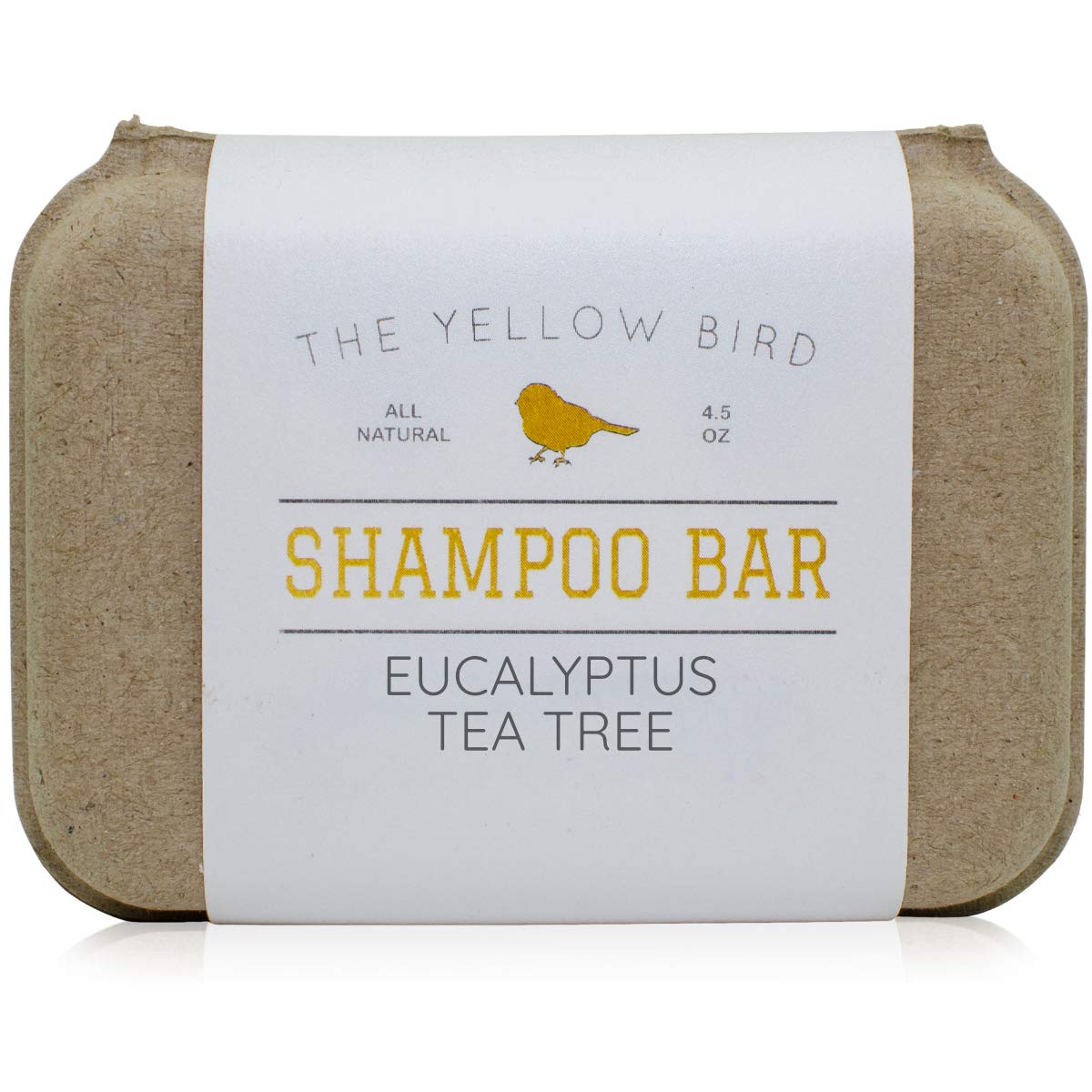 The Yellow Bird front-facing shampoo bar showing label and shape with clear eco benefit