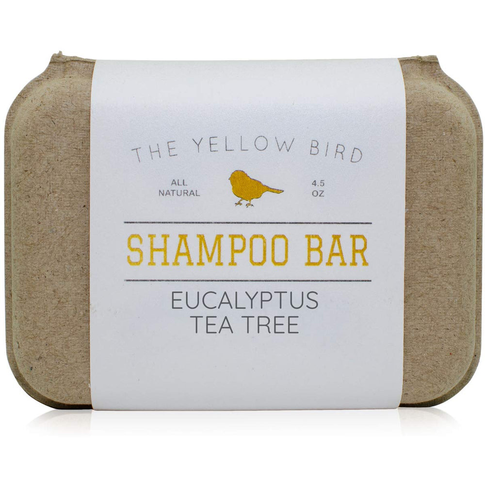The Yellow Bird front-facing shampoo bar showing label and shape with clear eco benefit