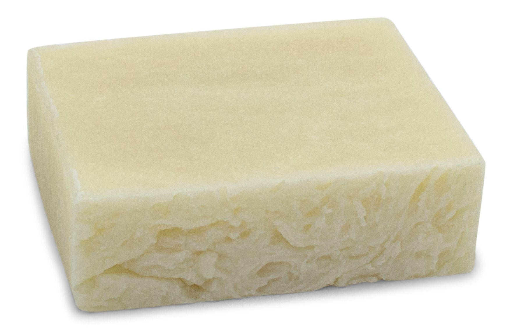 Hand holding The Yellow Bird soap bar showing size and easy grip for face and body cleansing