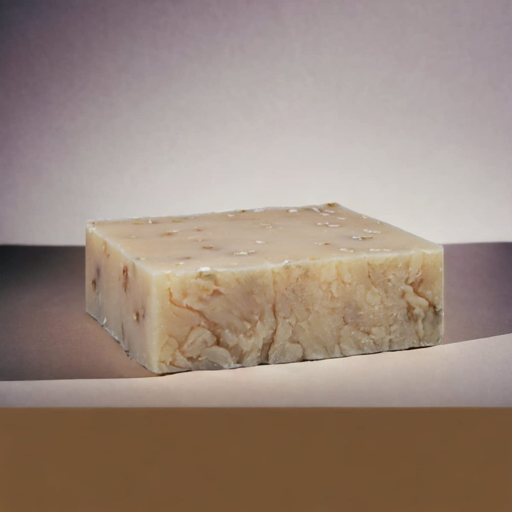 The Yellow Bird soap lather in hand demonstrating creamy moisturizing foam