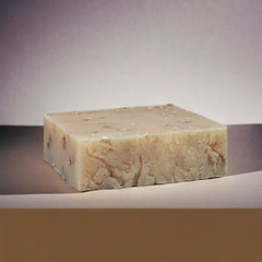The Yellow Bird soap lather in hand demonstrating creamy moisturizing foam