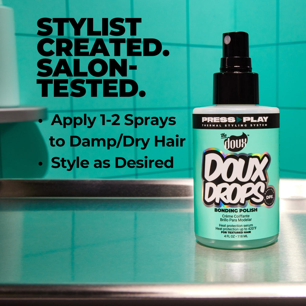 The Doux DOUX DROPS applied to curly hair delivering smooth, frizz-controlled finish