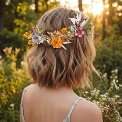 Thiccywoov floral pins arranged in bridal updo adding elegant decoration