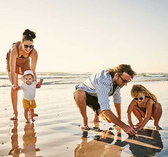 Thinksport on towel at beach, reef-safe formula suitable for ocean activities