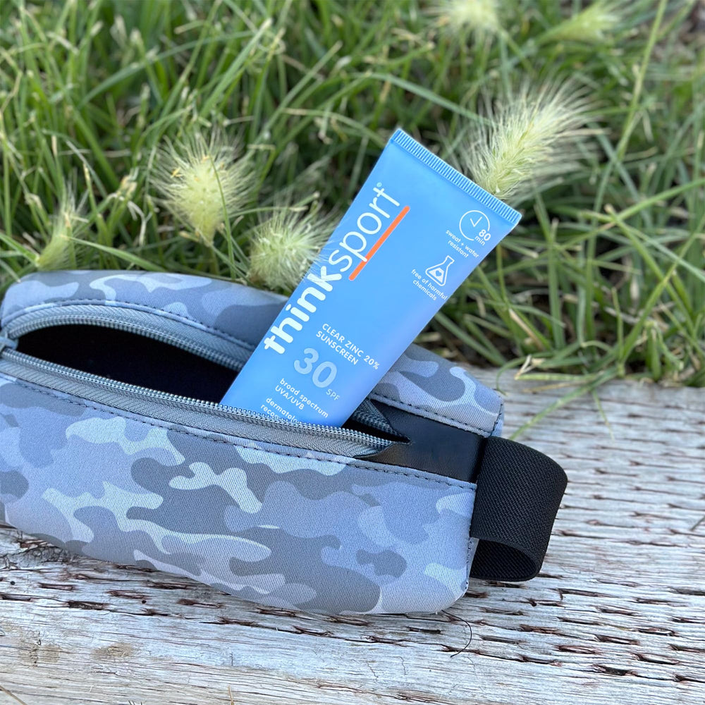 Athlete applying Thinksport before run, brand gives water-resistant sun protection