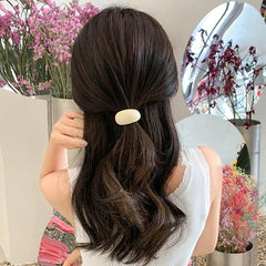 Thinslimer in use ponytail side profile demonstrating secure hold and crease-reducing benefit