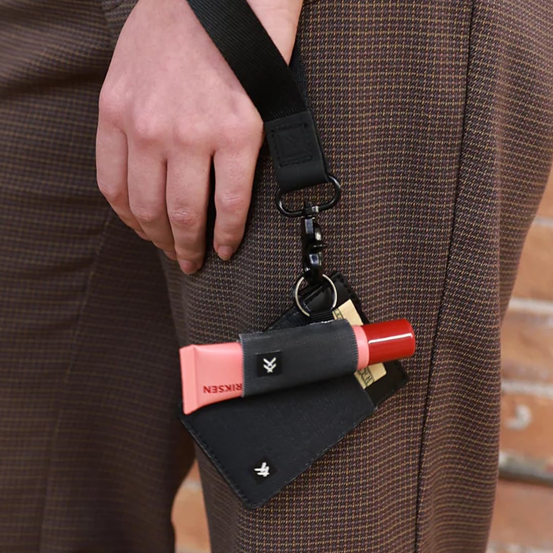 Thread Wallets holder clipped to outdoor bag showing secure carry for travel and hiking