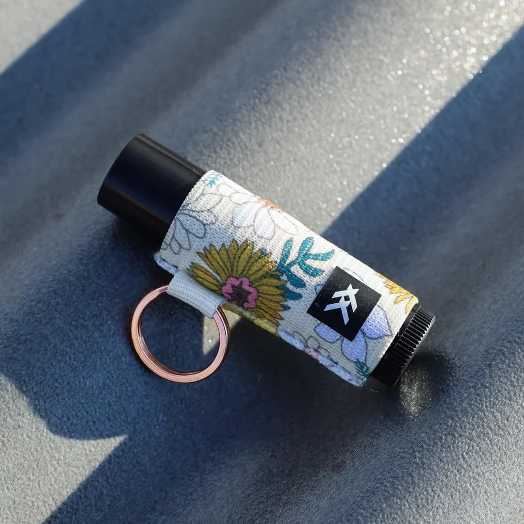Thread Wallets Blossom on a purse strap showing fashionable convenience benefit