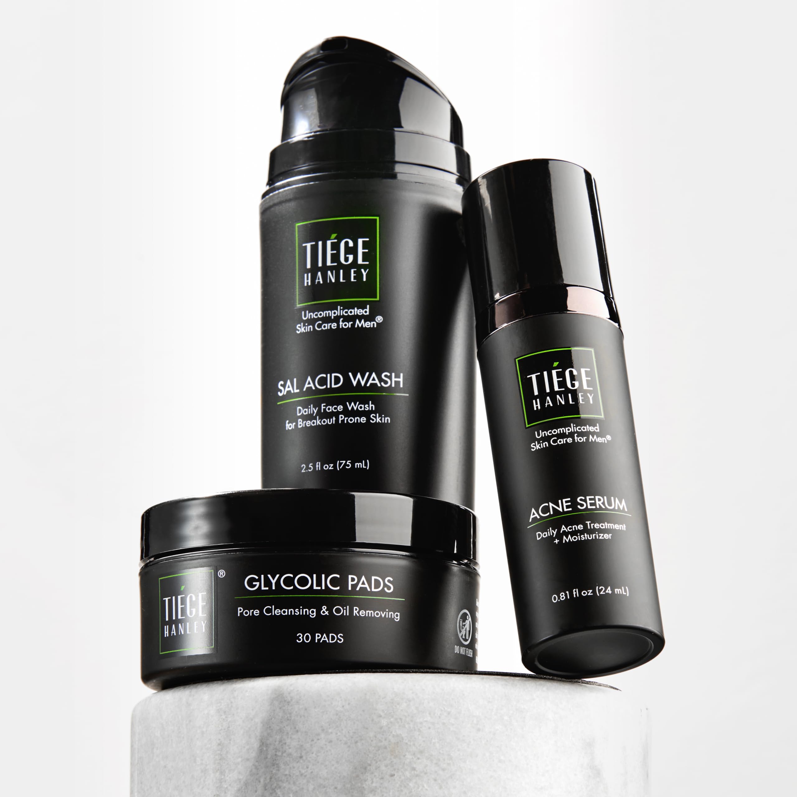 Tiege Hanley front packaging showing three-piece acne kit benefits