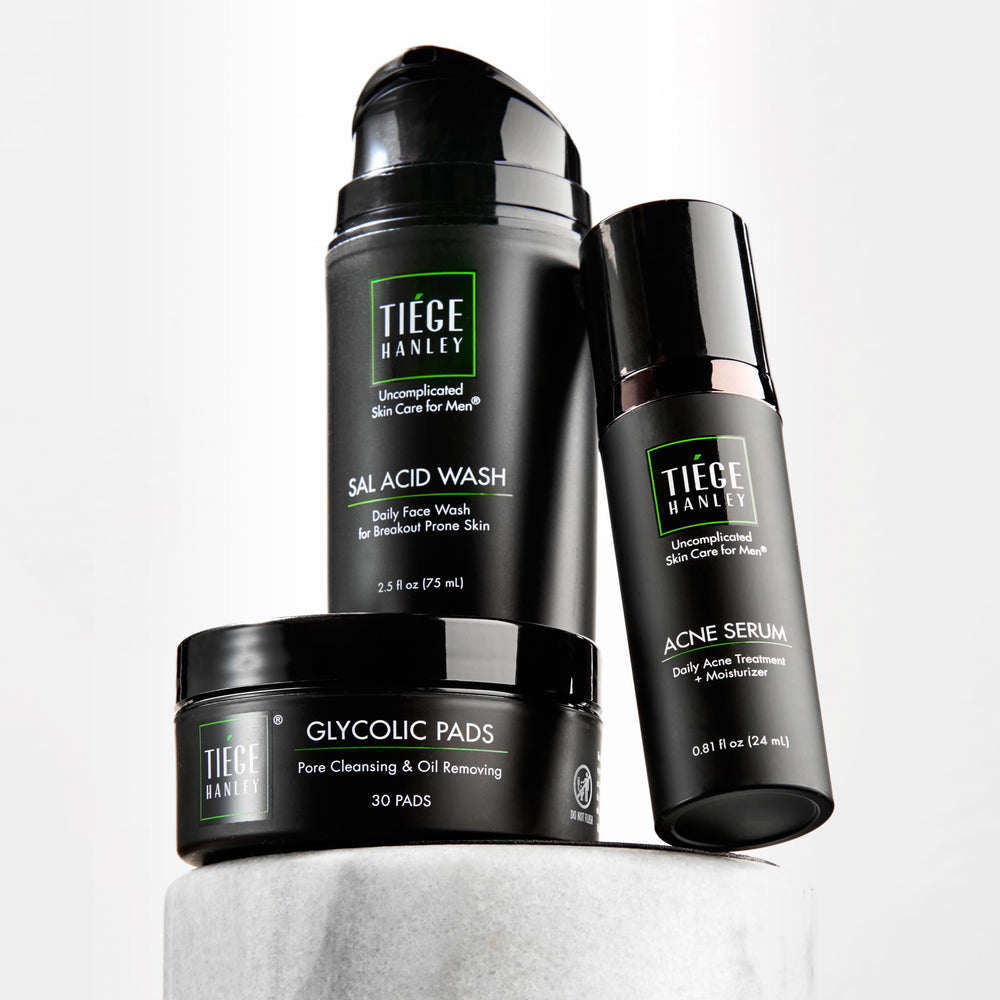 Tiege Hanley front packaging showing three-piece acne kit benefits