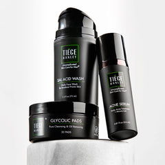 Tiege Hanley front packaging showing three-piece acne kit benefits