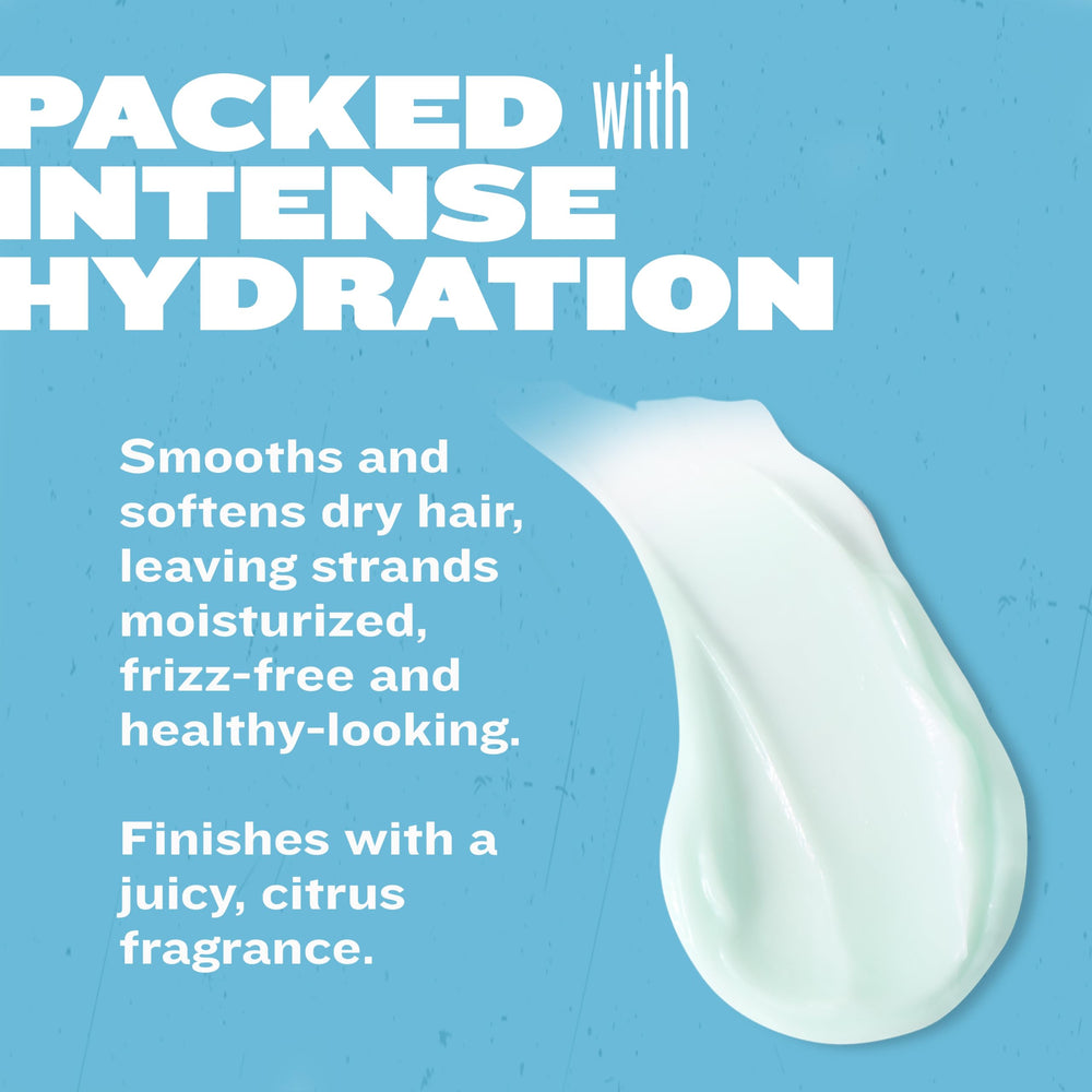 TIGI Bed Head travel conditioner pictured with other toiletries for travel convenience