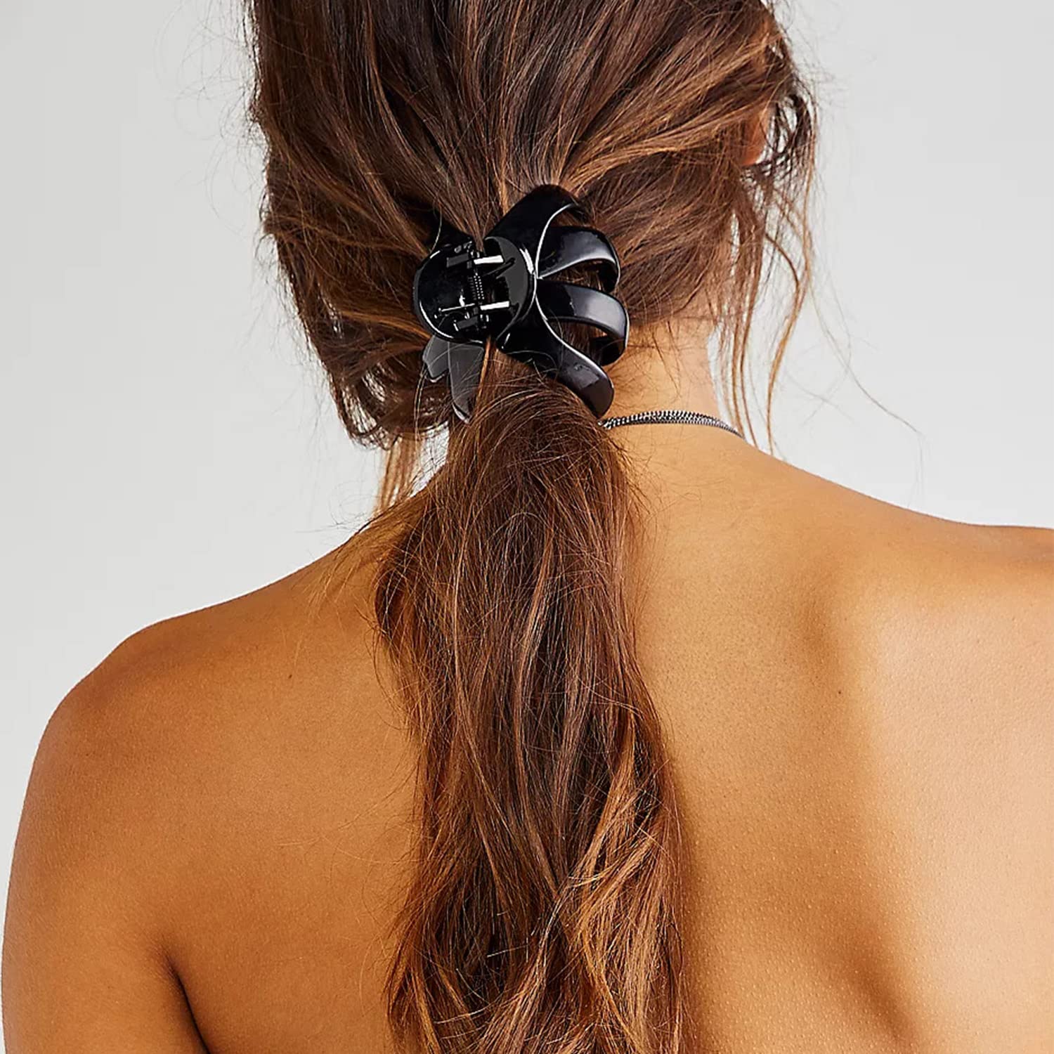 Tihebax black clip used in a bun showcasing elegant everyday look benefit