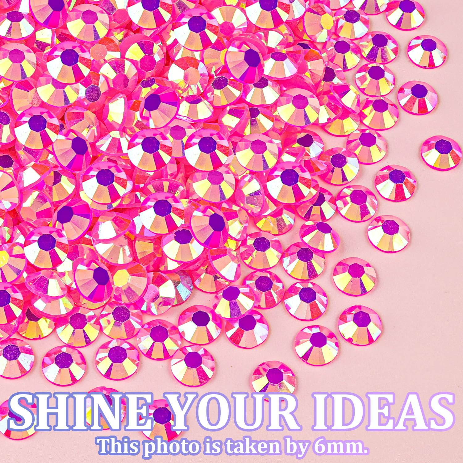 TINKRSTUFF rhinestones held next to a fingertip to show size range and practical scale