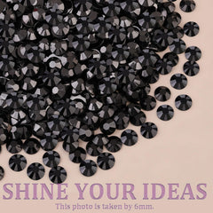TINKRSTUFF gems beside a hand for scale showing size variety and suitability for fine detail