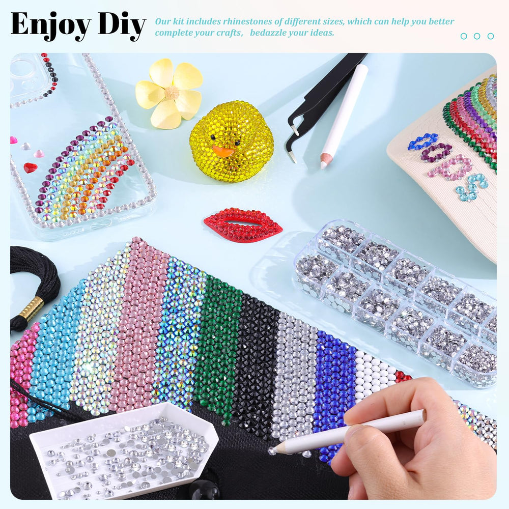 TINKRSTUFF rhinestones next to a hand for size and quantity scale reference
