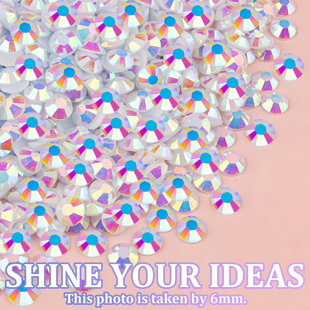 TINKRSTUFF rhinestones beside a hand for scale showing quantity and size