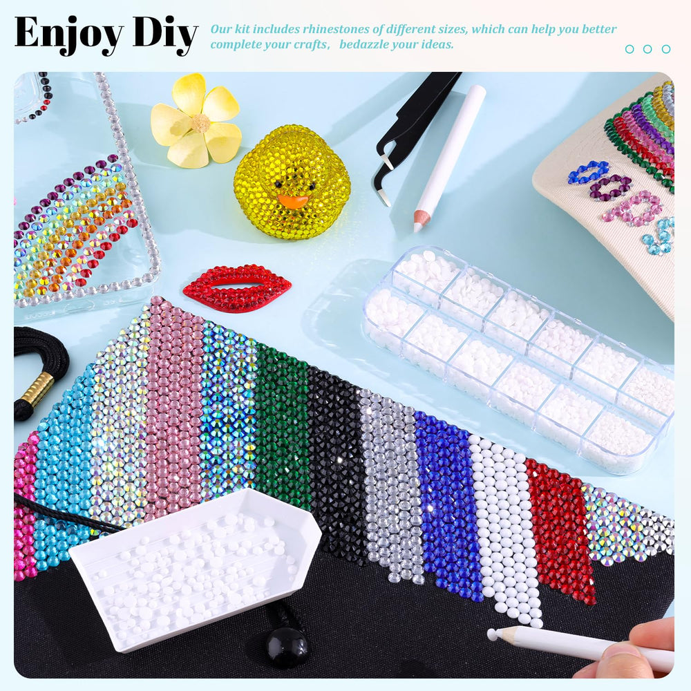 TINKRSTUFF tweezers and pickup pen placed beside gems for precise craft placement