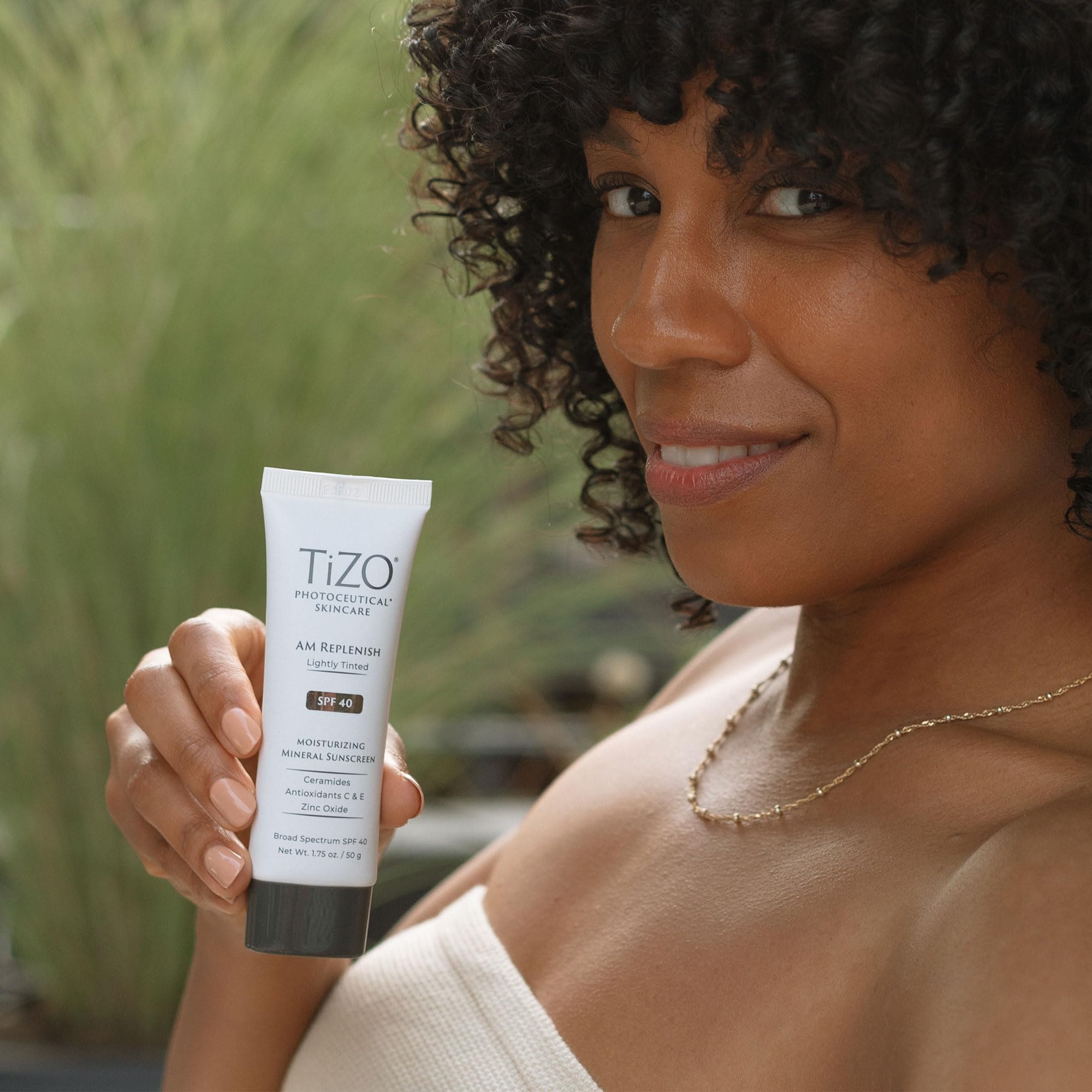 TIZO applied under makeup demonstrating smooth layering without pilling