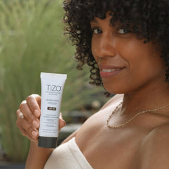 TIZO applied under makeup demonstrating smooth layering without pilling