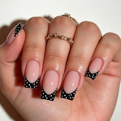 Tnampv close-up polka dot detail highlighting glossy finish and crisp white dots