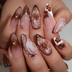 Tnbuokas close-up of brown flower and gold rhinestone detail enhancing elegance