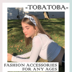 TOBATOBA headband next to hand for size comparison and fit clarity