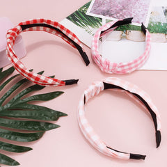TOBATOBA headband in holiday setting suggests seasonal styling and gift-ready benefit