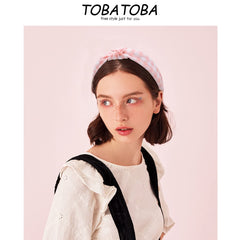 TOBATOBA headband next to ruler shows size and fit clarity benefit