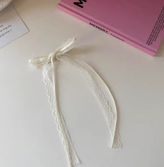 Tobeffect bow in outdoor picnic setting adding charming finish to casual outfit