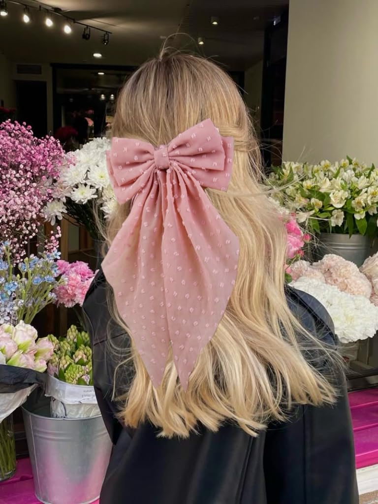 Tobeffect bow clipped to ponytail in use, adds instant polished finish
