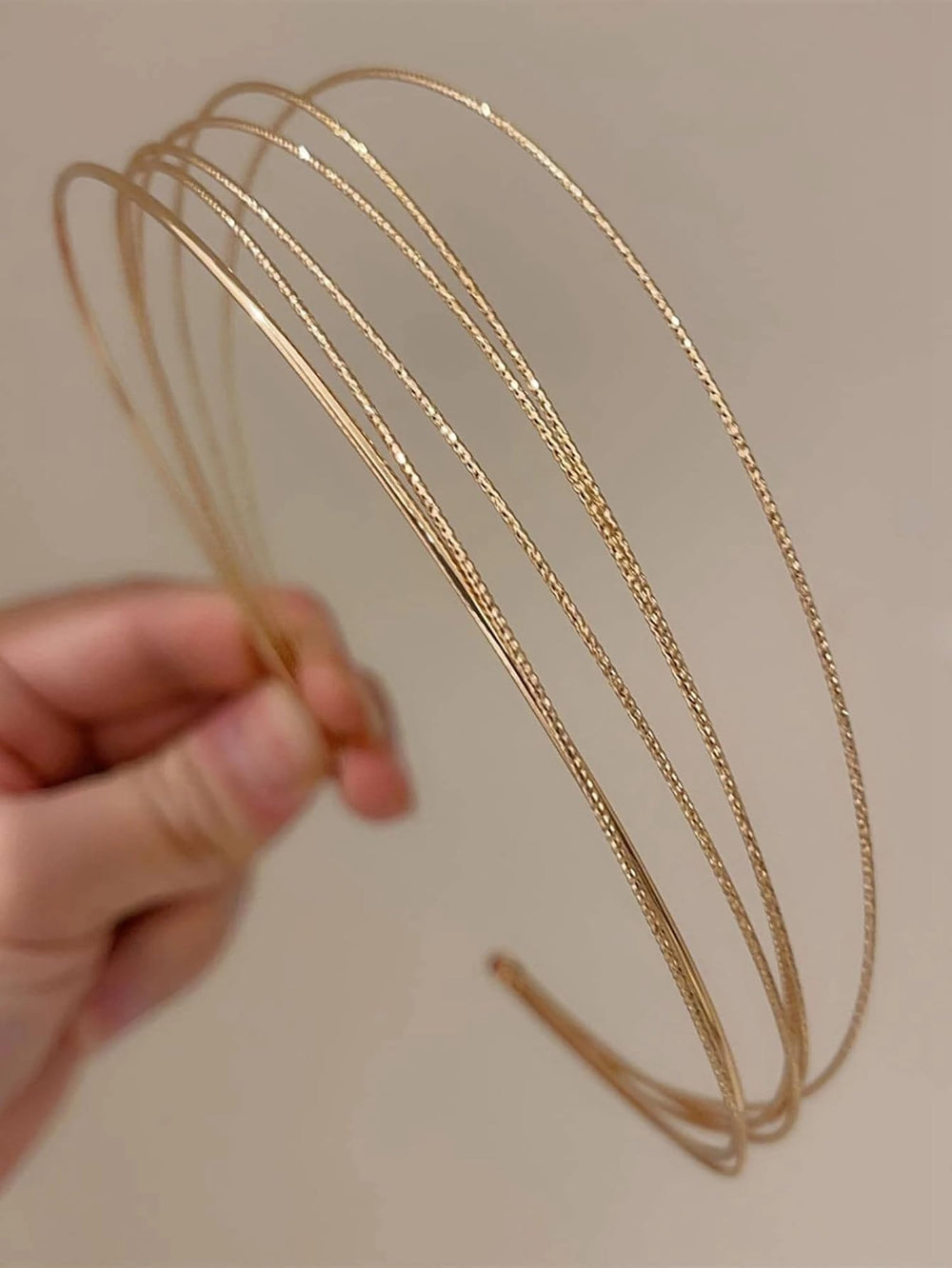Tobeffect gold headbands front view showing sleek layered design and polished finish