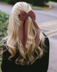 Tobeffect bow shown in hand for scale, clarifies large 8x16 inch size