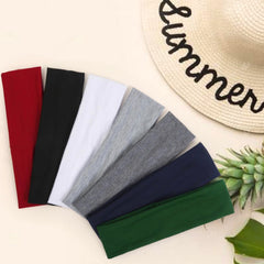 Tobeffect headband held in hand to show scale and comfortable stretch fit benefit