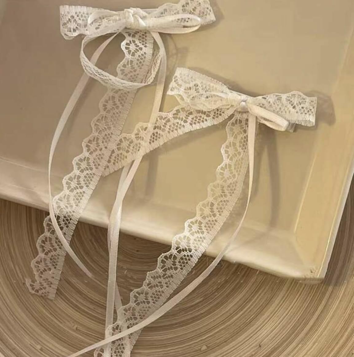 Tobeffect white lace bow front view showcasing delicate shape and feminine finish