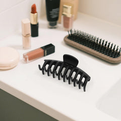 TOCESS clip holding high ponytail showing secure all-day hold and comfortable wear