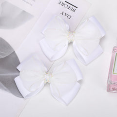 TOFAEVN bows styled in pigtails illustrating symmetrical look and easy use