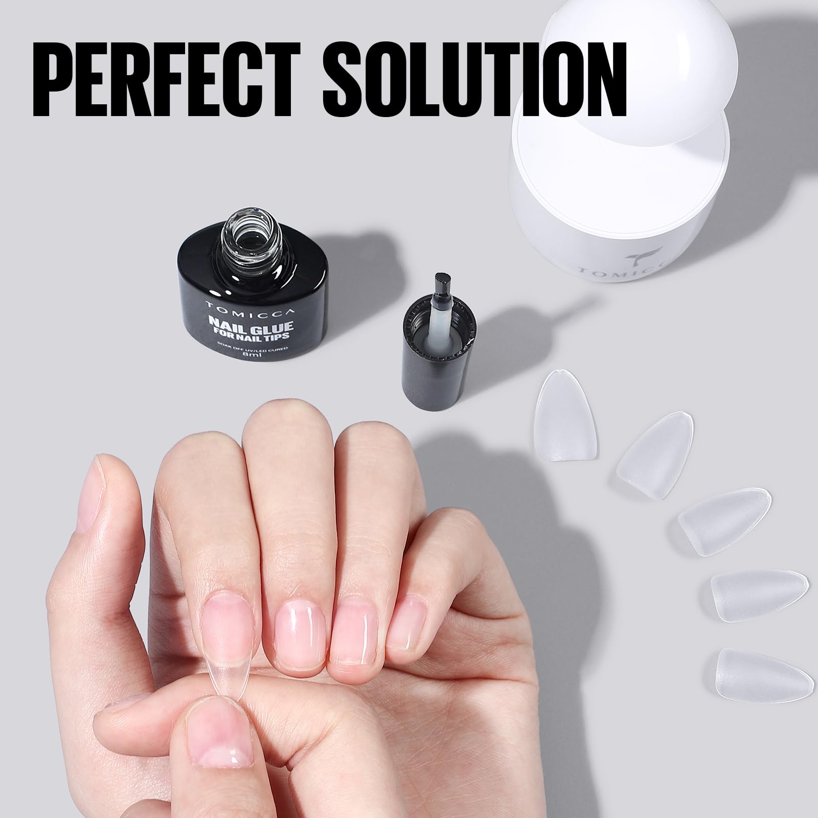 TOMICCA 8ml size beside a finger to show compact, travel-friendly convenience