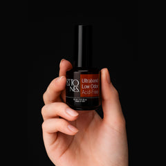TONES Ultrabond next to ruler showing 15ml bottle scale for salon and travel