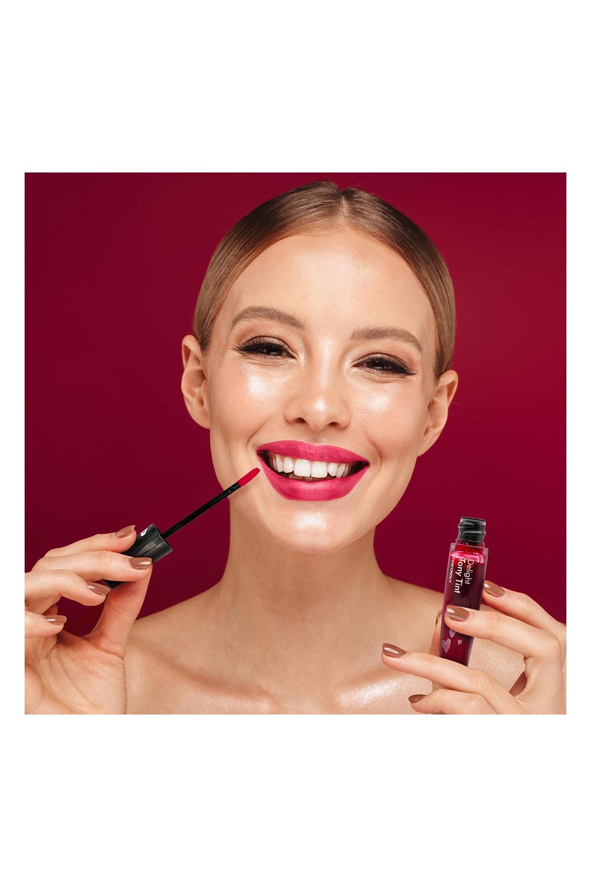 TONYMOLY creamy texture swatch showing cherry-pink color payoff and glossy finish