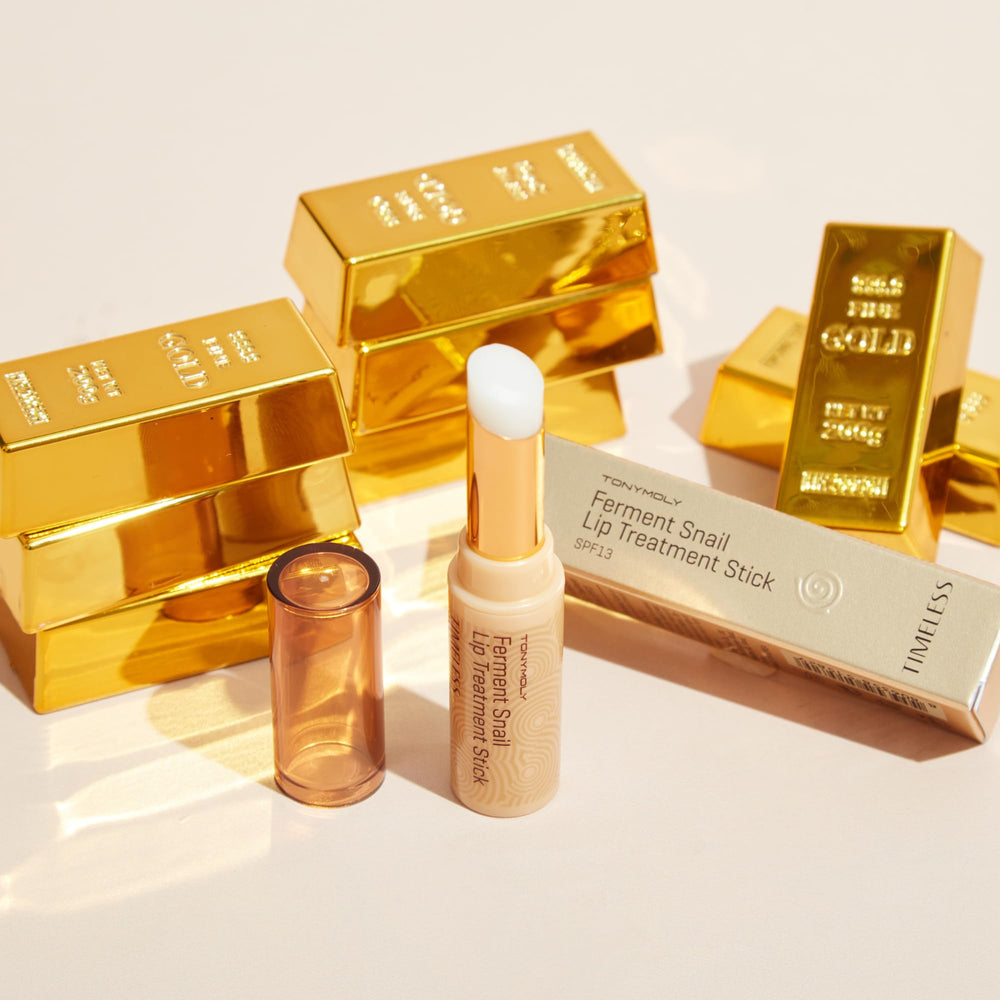 TONYMOLY lip balm next to a coin showing 3.5 g compact portability