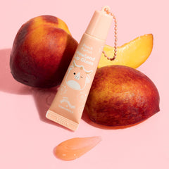 TONYMOLY lip gloss swatch on hand showing glossy peach sheen and comfortable wear