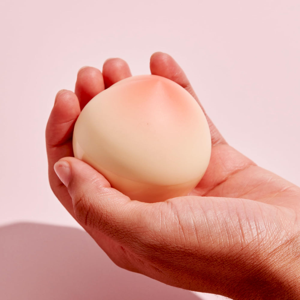 TONYMOLY open tube showing creamy texture and fast-absorbing formula benefit