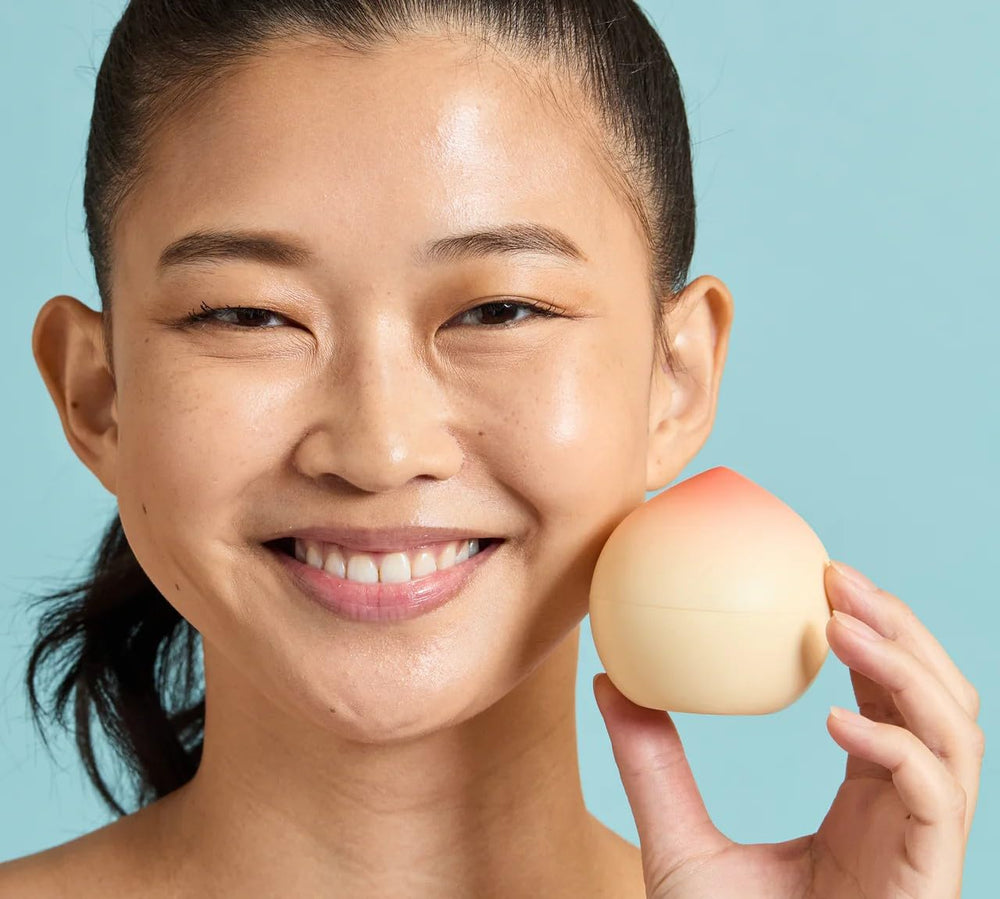 TONYMOLY next to a purse illustrating the compact 1.05 oz travel-friendly size