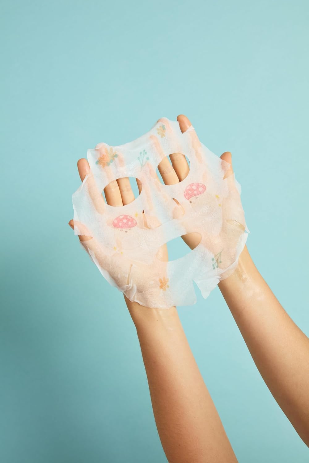 TONYMOLY glossy serum texture on fingers showing hydrating formula and fast absorption benefit