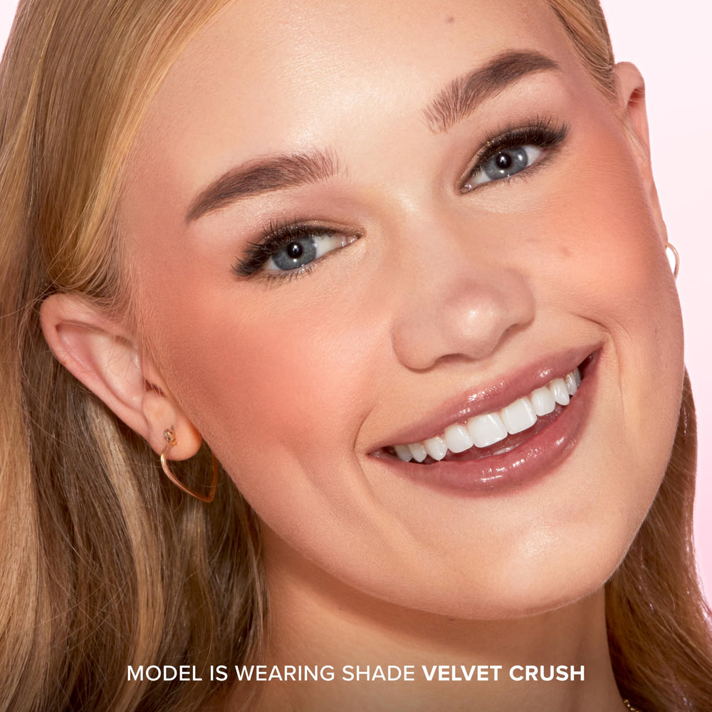 Too Faced brush applying blush for buildable, diffused cheek color