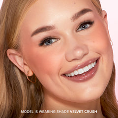 Too Faced brush applying blush for buildable, diffused cheek color