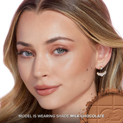 Too Faced bronzer swatch on forearm demonstrating buildable pigmentation