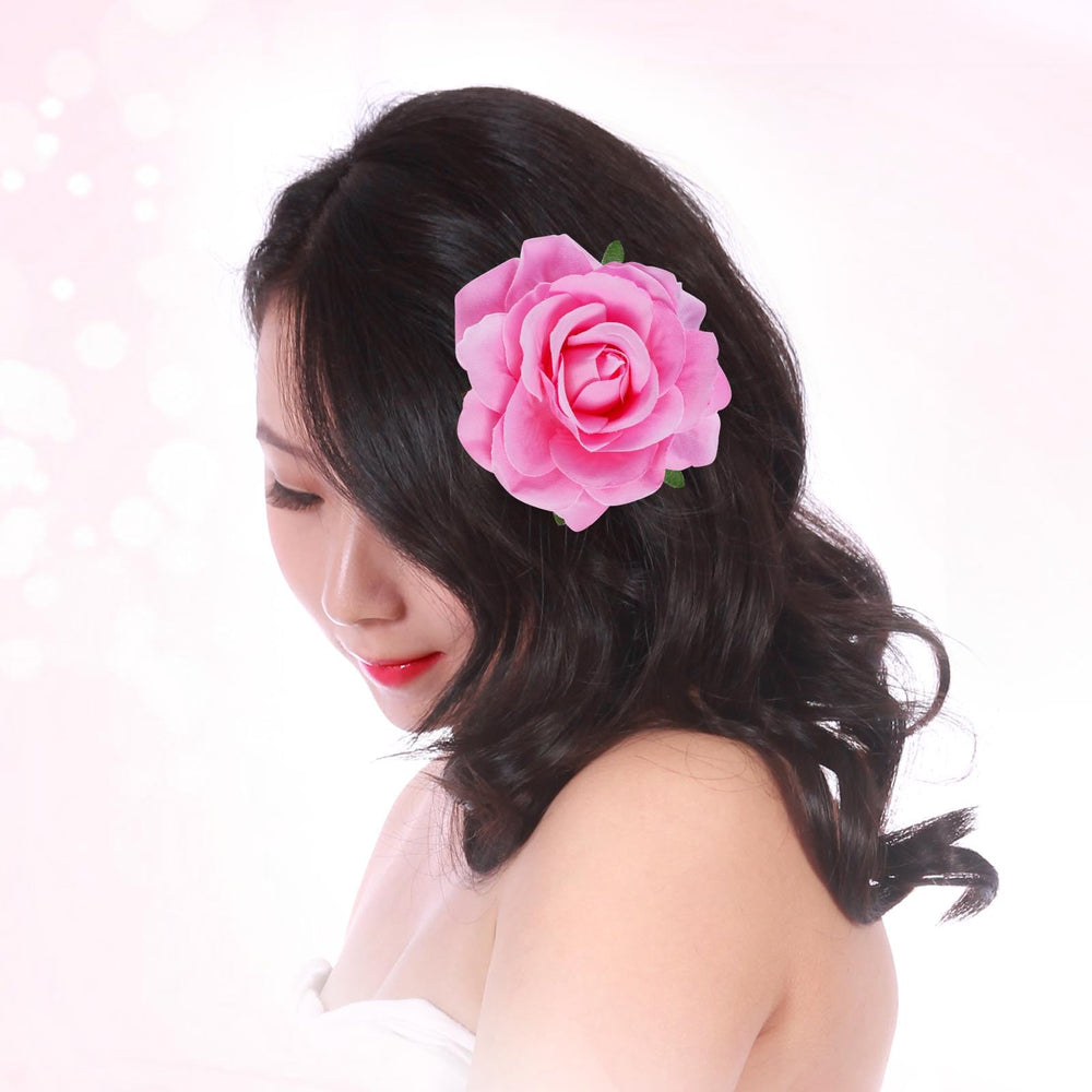 Topbuti rose hair clip worn in an updo, adding polished wedding flair