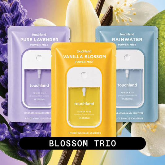 Three Touchland Blossom Trio bottles arranged to show Lavender Vanilla and Rainwater scents